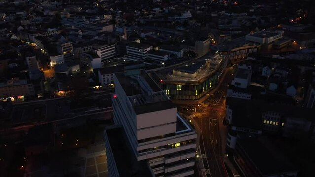Aerial night Cityscape of Kaiserslautern : Municipality building and shopping mall ( K-town ) in west Germany known for the U.S military Community of Ramstein Air force Base settling in the city.