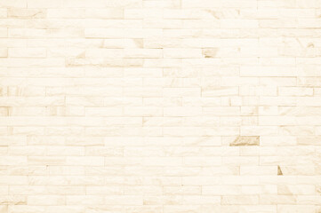 Empty background of wide cream brick wall texture. Beige old brown brick wall concrete or stone...