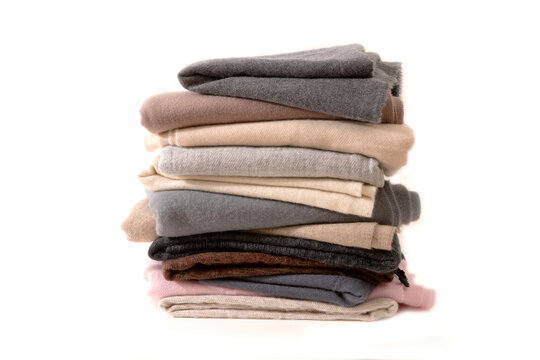 A stack of shawl wool fabric on a white background