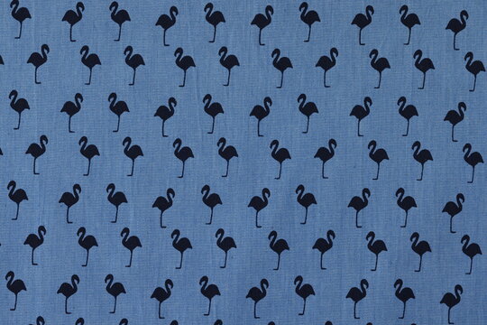 Blue fabric with black flamingo pattern prepared for sale