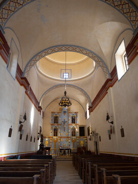 Interior of the Mission Concepcion in San Antonio, Texas, with Blue and Gold Reredos Behind the Altar and Painted Ceiling Above