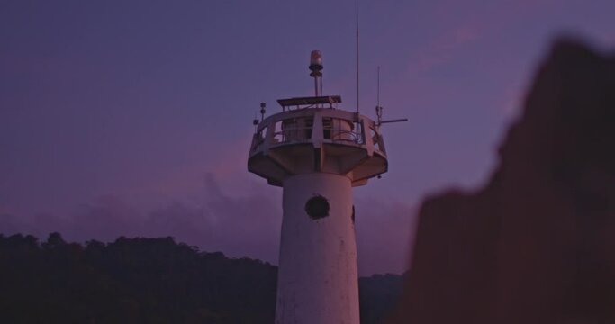 .light house landmark of Lanta island.lighthouse is on Tanod cap the end way of Lanta Yai island build on the hill. on the beach around light house full of beautiful round rock.and have many 