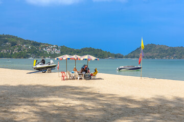 Fototapeta premium Patong Beach Phuket Thailand nice white sandy beach clear blue and turquoise waters and lovely blue skies with Palms tree