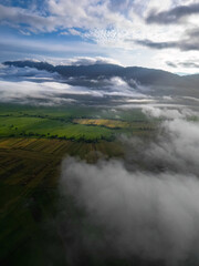 Aerial view of clouds in the morning and views of village rice fields