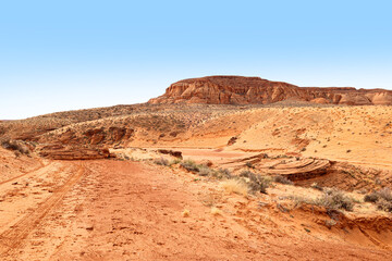 Fototapeta na wymiar Scenic view of desert in Arizona at noon with blue sky