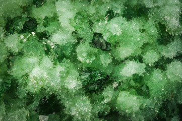 fake artificial green quartz, macro detail texture background. close-up raw rough unpolished semi-precious gemstone
