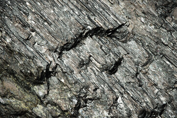 Hypersthene. macro detail texture background. close-up raw rough unpolished semi-precious gemstone
