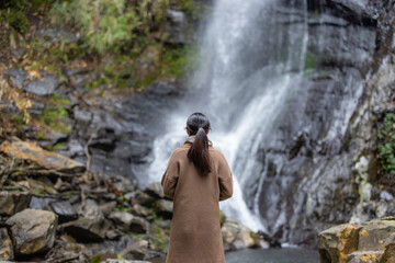 Tourist woman go hiking view the Wufengqi waterfall in Yilan of Taiwan