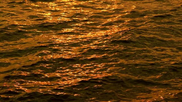 sea water and waves at sunset The magic of tropical waters and paradise beaches in the Andaman Sea.