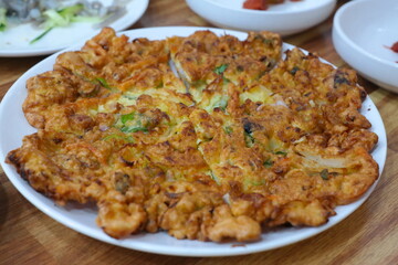 Haemulpajeon is a Korean whole dish with plenty of green onions and seafood. Seafood and green onion pancake characterized by the harmony of soft green onions and fresh seafood