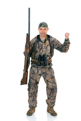 Full lengt portrait of happy duck hunter with a rifle and binoculars winning the prize, isolated on white background. Fifty-year-old man in hunting uniform standing in studio.