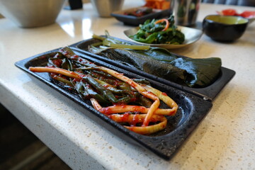 A type of Korean kimchi made with finely trimmed medium-sized chives or thin green onions. 