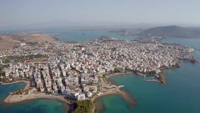 4k drone flight down footage (Ultra High Definition) of Chalcis town. Adorable morning seascape of Aegean sea, North Euboean Gulf. Incredible summer scene of Euboea island, Greece, Europe.