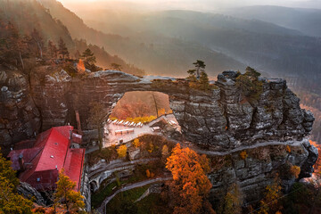 Hrensko, Czech Republic - Aerial view of the beautiful Pravcicka Brana (Pravcicka Gate) in Bohemian Switzerland National Park, the biggest natural arch in Europe on an warm autumn morning at sunrise