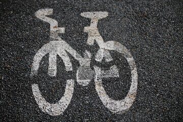 Bicycle Path Sign Image Painted on Black Road