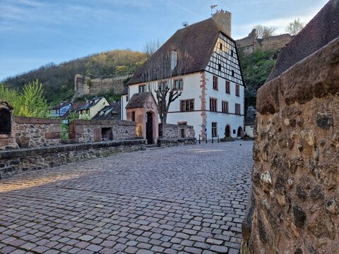 Medieval stone bridge over river in centre of Kaysersberg, small town in Alsace (France, Europe) in wintertime