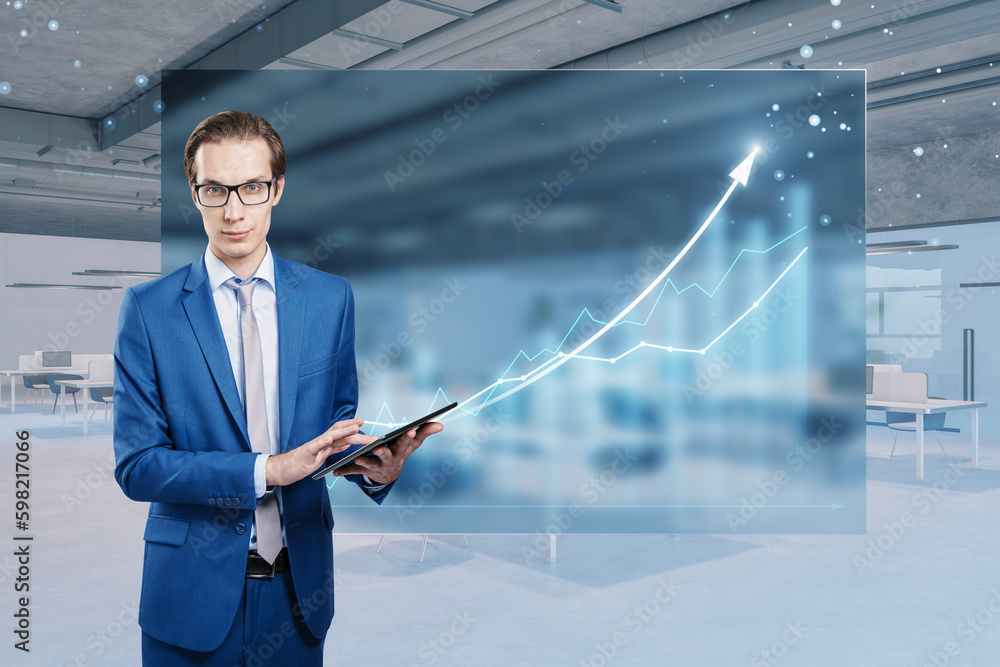 Poster young businessman using tablet with abstract growing business chart hologram on blurry office interi