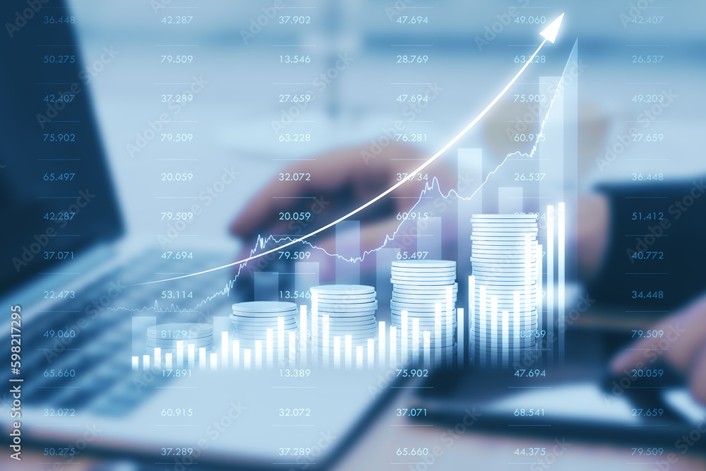 Poster close up of hands using pad and laptop at desktop with growing blue financial coins chart on blurry 