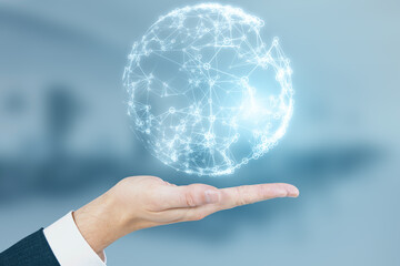 Close up of businessman hand holding glowing blue polygonal globe on blurry office interior background. Global technology and metaverse concept.