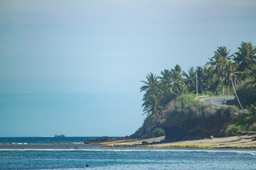 Road on the cliff next to the sea in Lombok Island, Indonesia