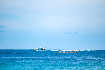 Ships in the sea, a ferry and fishing boat in Lombok Island, Indonesia