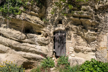 Antique wooden door on a stone façade