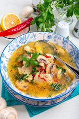 Spicy chicken soup with mushrooms.