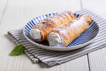 Puff cones with cream.