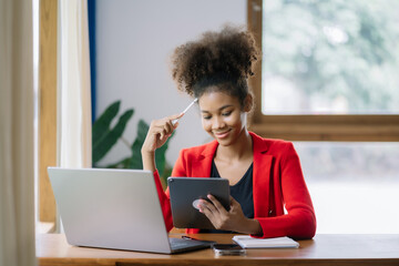 Thinking about how to take the business to technological heights. attractive young businesswoman working in her home office.