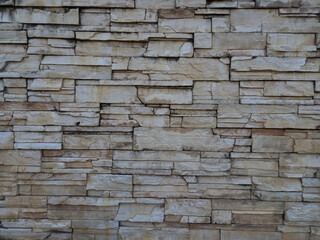 Natural stone wall texture as background for interior, exterior decoration and industrial construction concept design. Close-up 