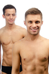 Fototapeta na wymiar Young attractive gay couple posing in the studio. Happiness, love and relationships.