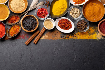 Various spices on stone table
