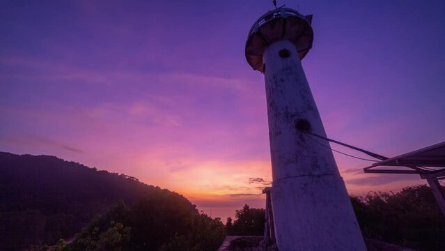 time lapse fantastic sky of sunrise at Lanta lighthouse..light house landmark of Lanta island..lighthouse is on Tanod cap the end way of Lanta Yai island build on the hill. .
