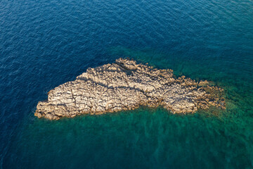Small craggy islet Triget near Pag, Croatia