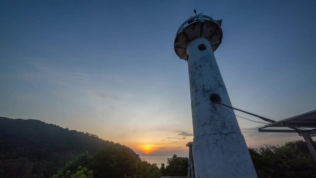 time lapse fantastic sky of sunrise at Lanta lighthouse..light house landmark of Lanta island..lighthouse is on Tanod cap the end way of Lanta Yai island build on the hill. .