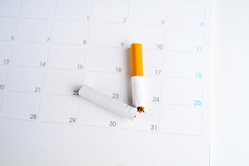 Close-up shot of cigarettes on a calendar world no smoking day