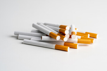 Many cigarettes on white background with copy space. The drug is harmful to the respiratory system.