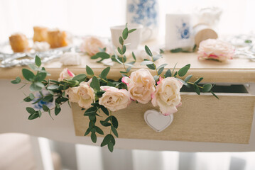 Candy bar decoration at a wedding or party with rose flowers