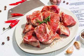 Paper culinary recipe for preparation pork. Raw ingredients includes pork loin pieces, spices, herbs