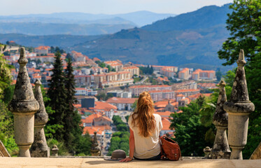 Lamego city landscape panoramic view- Woman travel in Portugal- Viseu province, near Porto - obrazy, fototapety, plakaty