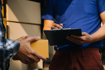 Business woman start up small business entrepreneur SME success .freelance woman working at home with Online Parcel delivery. SME and packaging deliveryconcept