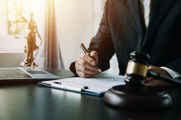 Business and lawyers discussing contract papers with brass scale on desk in office. Law, legal services, advice, justice and law concept picture with film grain effect