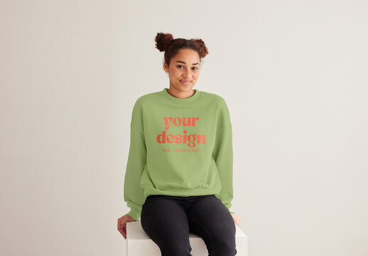 Mockup of customizable sweatshirt being modelled by woman, front view