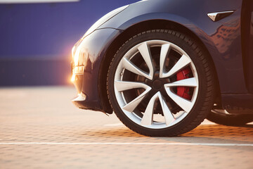 Close up view of tire of the modern automobile. Beautiful sunlight