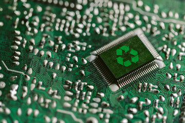 Environment green technology computer chip. Green world icon on circuit board technology...
