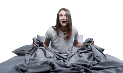 Shocked woman waking up from a nightmare