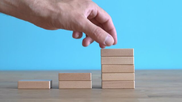 Growth, target, upskill concept. Growth of wooden cubes on a clean background. Business, economics, strategy idea Generative AI