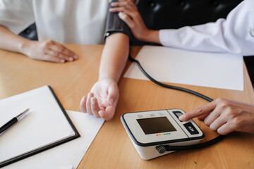 Doctor checking  patient arterial blood pressure. Health care