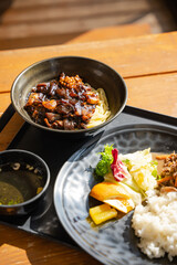 authentic jajangmyeon; it's a popular Korean dish, noodles in black bean sauce mixed with seafood, zuccini, onions, and other vegetables