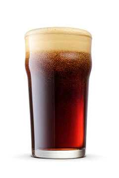 British style pint glass of stout beer with cap of foam isolated. Transparent PNG image.